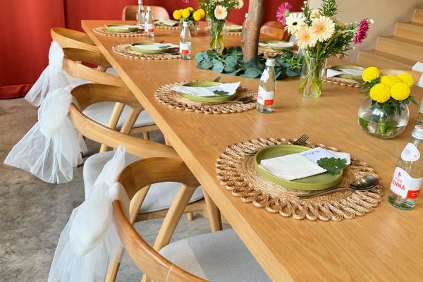 Decorated table and chairs set up for an event at Ruema Cafe